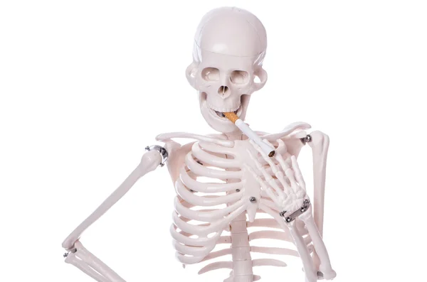 Skeleton smoking cigarette isolated on white — Stock Photo, Image