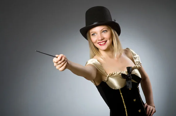 Woman magician with magic wand and hat — Stock Photo, Image