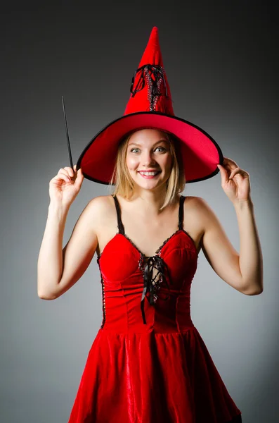 Woman magician doing her tricks with wand — Stock Photo, Image