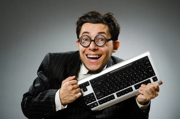 Comouter geek with computer keyboard Royalty Free Stock Photos