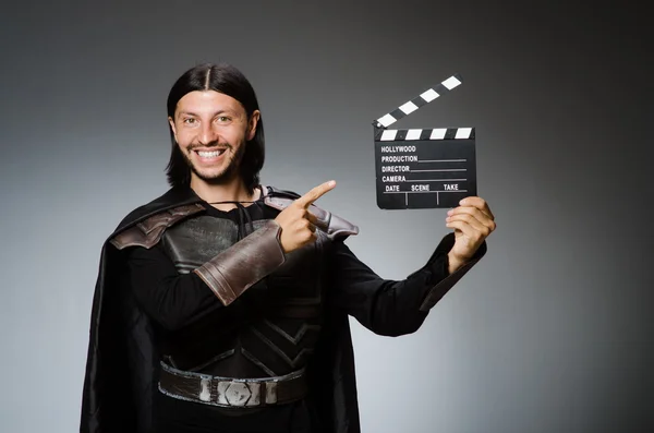 Knight with the movie board clapperboard — Stock Photo, Image