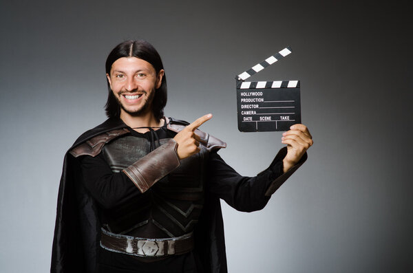 Knight with the movie board clapperboard