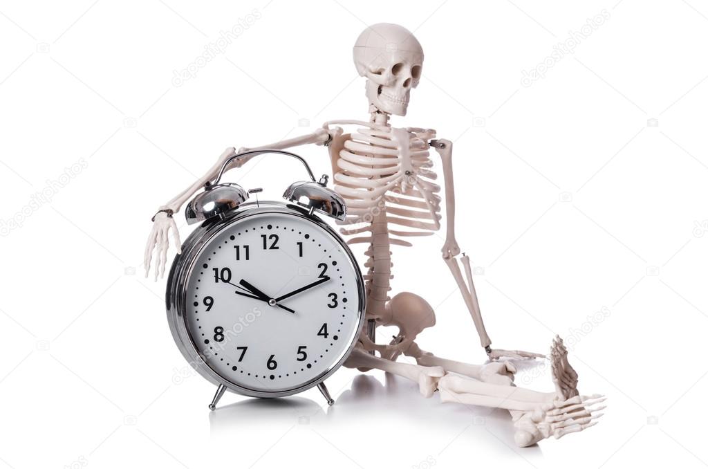 Skeleton with alarm clock on the white