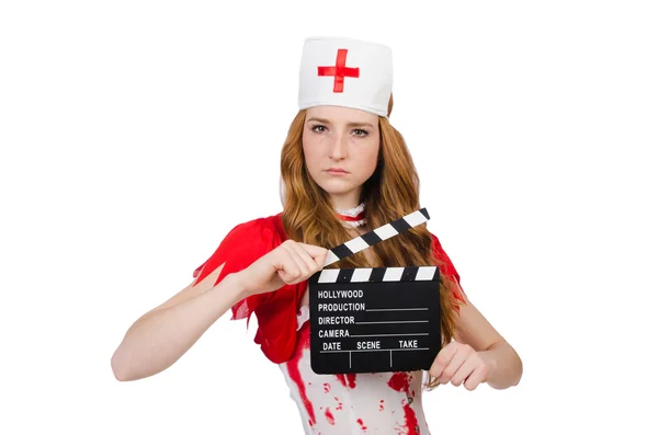 Woman doctor in bloody uniform with movie clapperboard — Stock Photo, Image