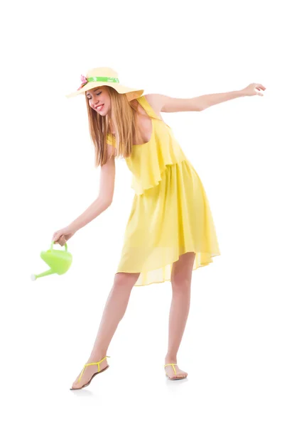 Woman in yellow dress with watering can — Stock Photo, Image