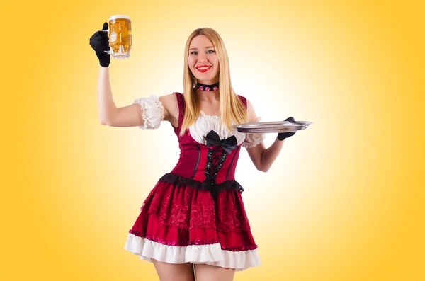 Young waitress with beer on white — Stock Photo, Image