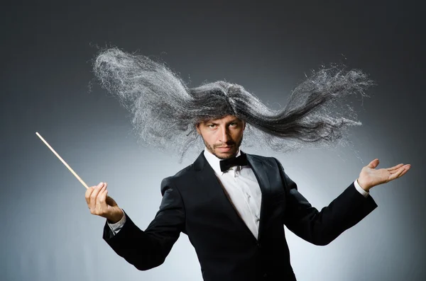 Funny conductor with long grey hair — Stock Photo, Image