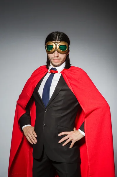 Superman concept with man in red cover — Stock Photo, Image