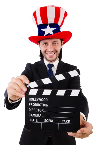 Man with USA hat and movie board isolated on white — Stock Photo, Image