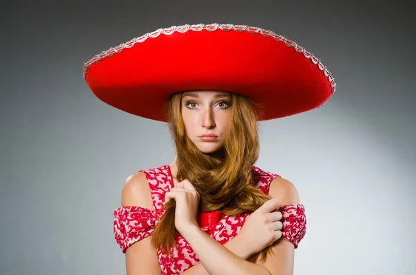 Mexican woman wearing red sombrero — Stock Photo, Image