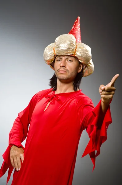 Funny wizard wearing red dress — Stock Photo, Image