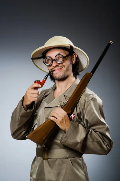 Hunter with rifle and smoking pipe — Stock Photo, Image