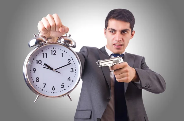 Hombre con pistola y reloj — Foto de Stock
