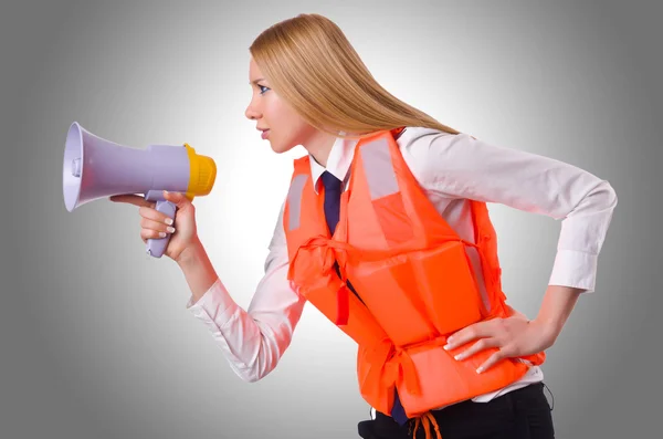 Woman with vest and loudspeaker — Stock Photo, Image