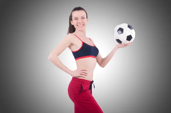 Jeune femme avec football sur blanc — Photo