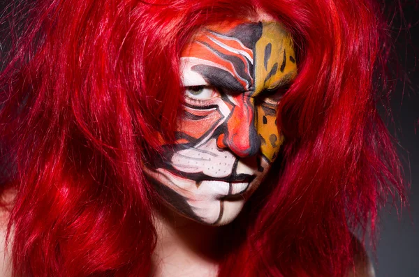 Woman with tiger face — Stock Photo, Image