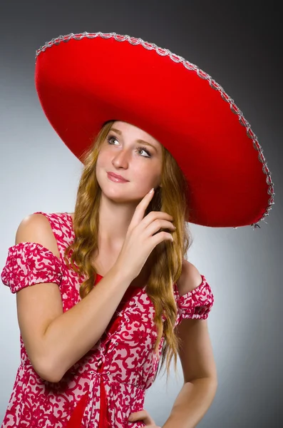 Mexican woman wearing red sombrero — Stock Photo, Image