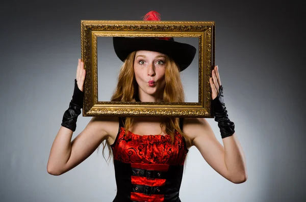 Woman pirate with picture frame — Stock Photo, Image
