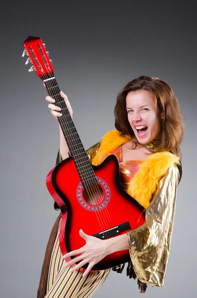 Guitar player with red instrument — Stock Photo, Image