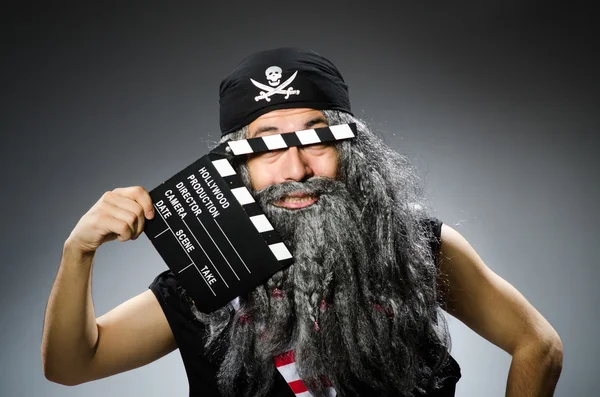 Old pirate with movie board — Stock Photo, Image