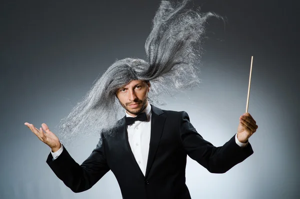 Funny conductor with long grey hair — Stock Photo, Image