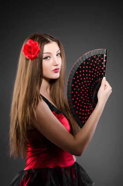 Woman with flower and fan — Stock Photo, Image