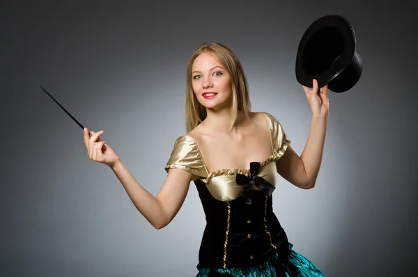 Woman magician with magic wand and hat — Stock Photo, Image