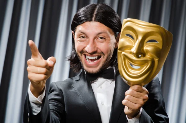 Funny concept with theatrical mask Stock Picture