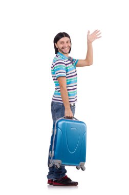 Genç adam beyaz bavullarla seyahat ediyor.