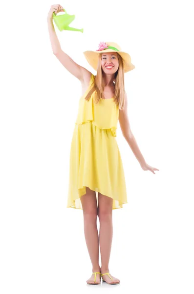 Mulher em vestido amarelo com regador pode — Fotografia de Stock