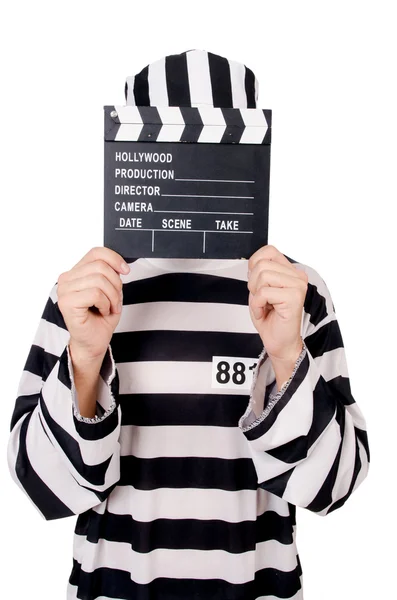 Funny prison inmate with movie board isolated on white — Stock Photo, Image