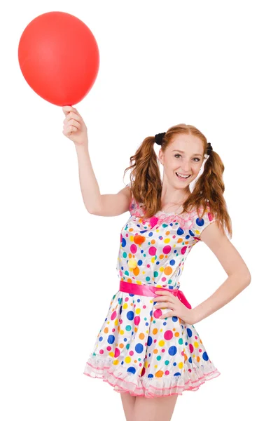 Jonge vrouw met rode ballon geïsoleerd op wit — Stockfoto