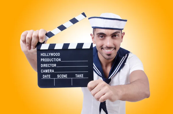 Sailor with movie clapper — Stock Photo, Image