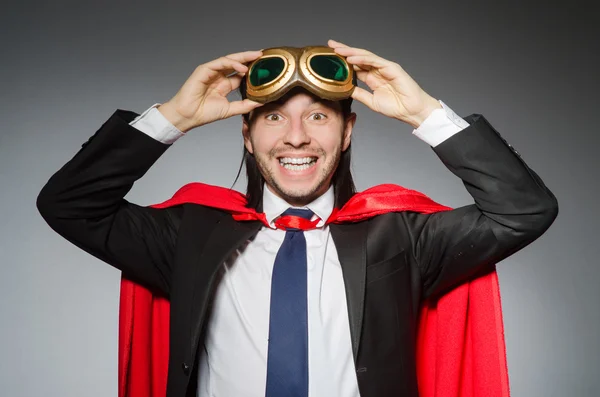 Superman concept with man in red cover — Stock Photo, Image