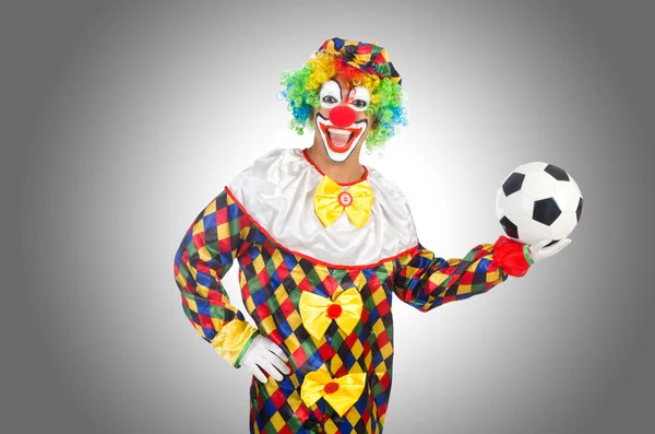 Clown with football ball on white — Stock Photo, Image