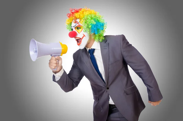 Geschäftsmann Clown mit Lautsprecher auf weiß — Stockfoto