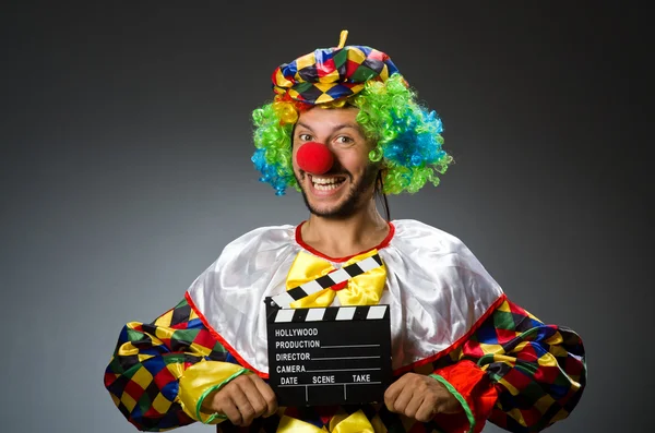 Clown con film applauso bordo — Foto Stock
