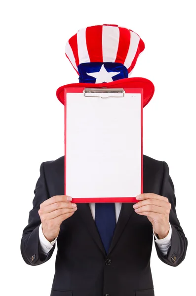 Businessman wearing USA hat with paper on white — Stock Photo, Image