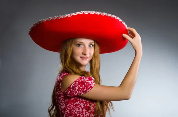 Mexican woman wearing red sombrero — Stock Photo, Image