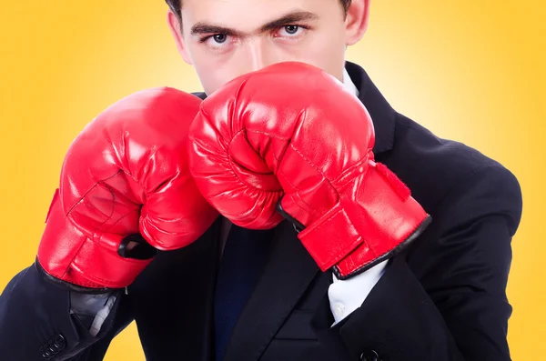 Young businessman with red gloves — Stock Photo, Image
