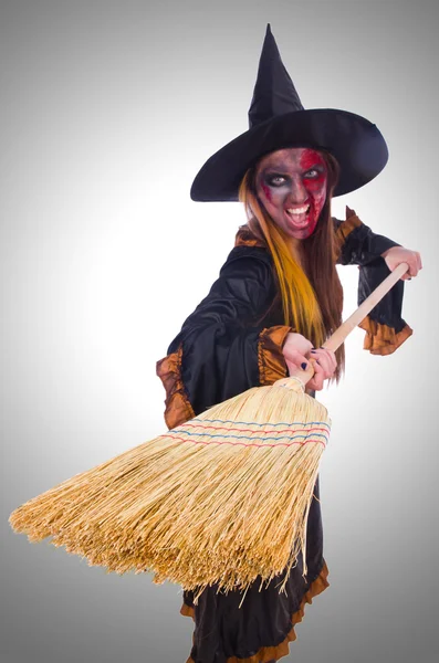 Halloween witch with a broom — Stock Photo, Image