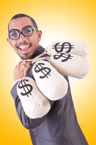 Hombre con sacos de dinero — Foto de Stock