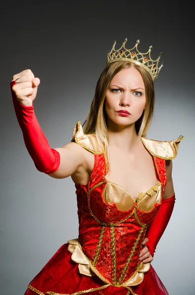 Angry queen in red dress — Stock Photo, Image