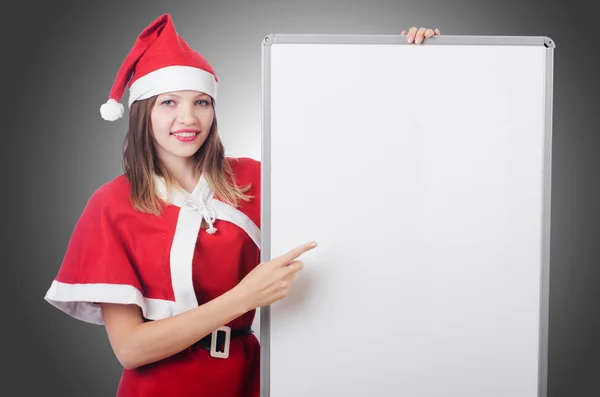 Jovem mulher no vermelho santa traje — Fotografia de Stock