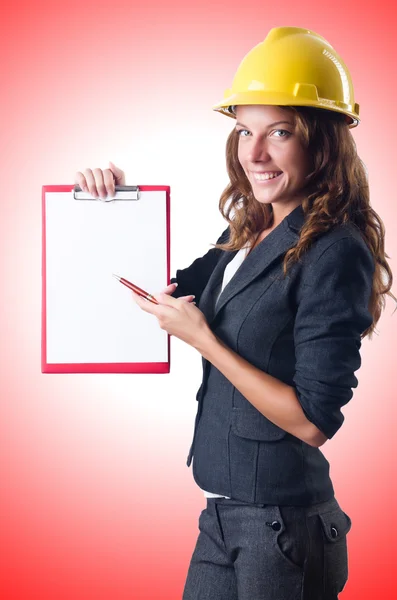 Woman with hard hat and binder — Stock Photo, Image