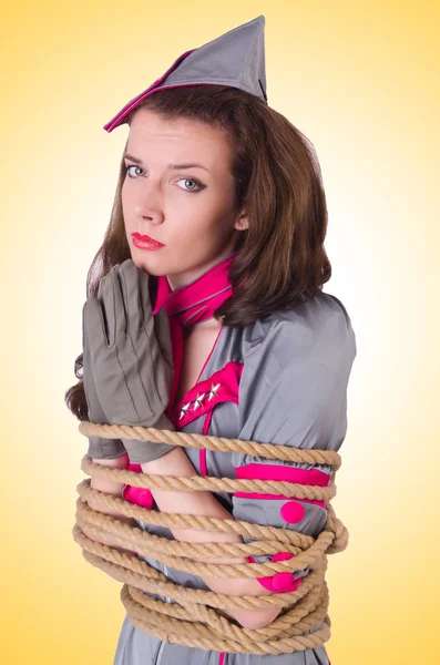 Female stewardess tied with rope — Stock Photo, Image