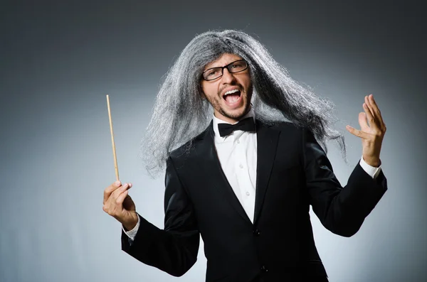 Funny conductor with long grey hair — Stock Photo, Image