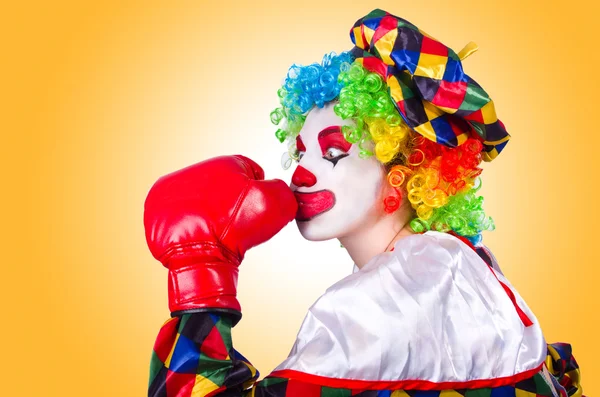 Funny clown in red gloves — Stock Photo, Image