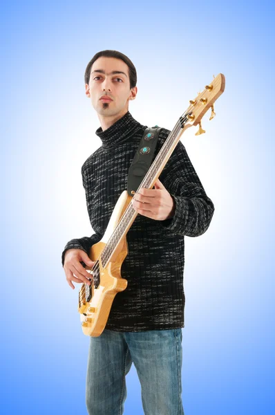 Young man playing the guitar — Stock Photo, Image