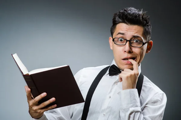 Funny young man with books — Stock Photo, Image